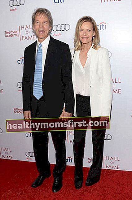 デビッドE.ケリーと妻のミシェルファイファーは、2014年3月にカリフォルニア州ビバリーヒルズで開催されたテレビアカデミーの第23回殿堂入りガラに出席します。