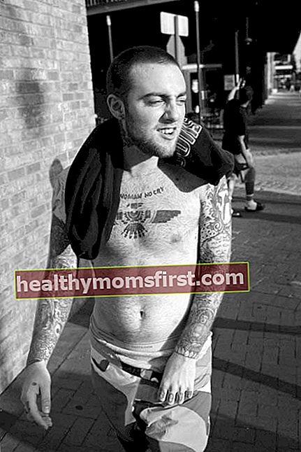 Mac Miller bertelanjang dada memamerkan koleksi tato tubuhnya dalam pemotretan tahun 2014