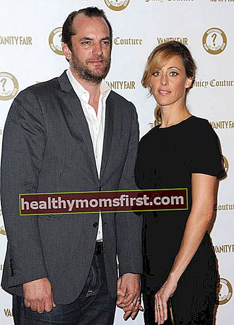 Kim Raver bersama suaminya Manuel Boyer di sebuah acara yang diselenggarakan oleh Vanity Fair pada tahun 2012